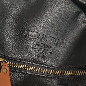 Prada Black Pebbled Leather Backpack with Gold Hardware